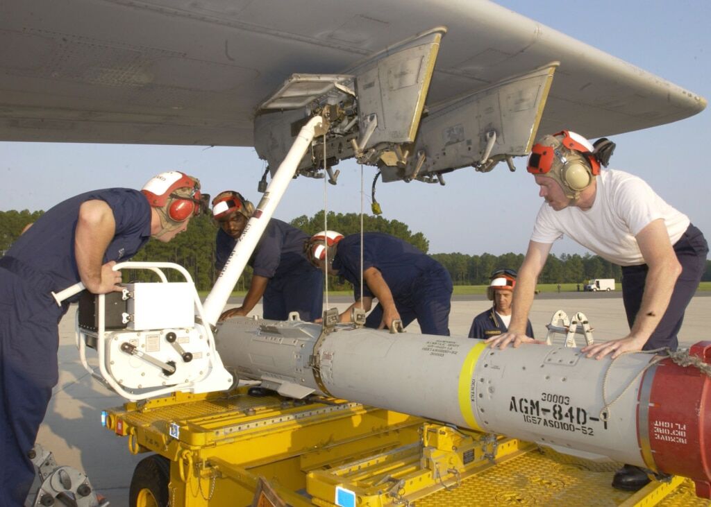 U.S. Navy personnel load an AGM-84D Harpoon missile onto a P-3 Orion. Photo: U.S. Navy