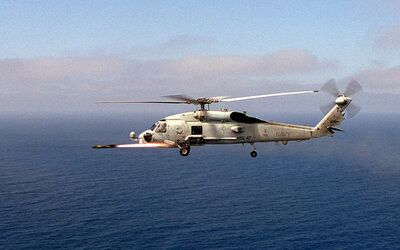 A U.S. Navy SH-60 Seahawk helicopter fires a Hellfire missile. Photo: U.S. DoD